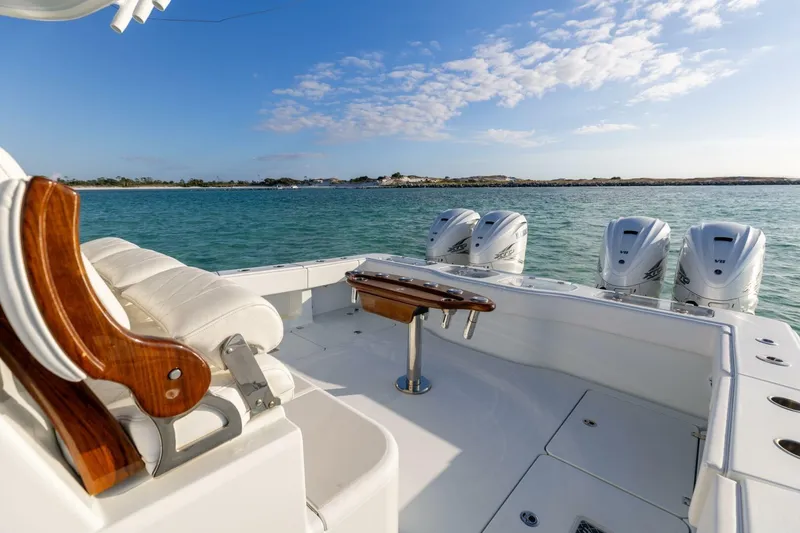 Slide: The Image of Luxury Freeman 47 boat, 2024 model, with four powerful engines on a serene sea. - 6