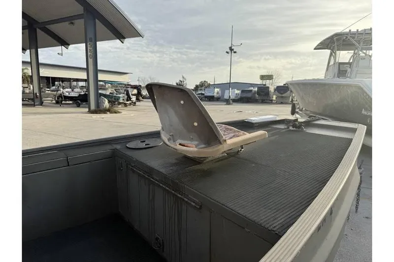 Slide: The Image of 2012 Gator Trax 17X54 boat with open seat, parked outdoors. - 13