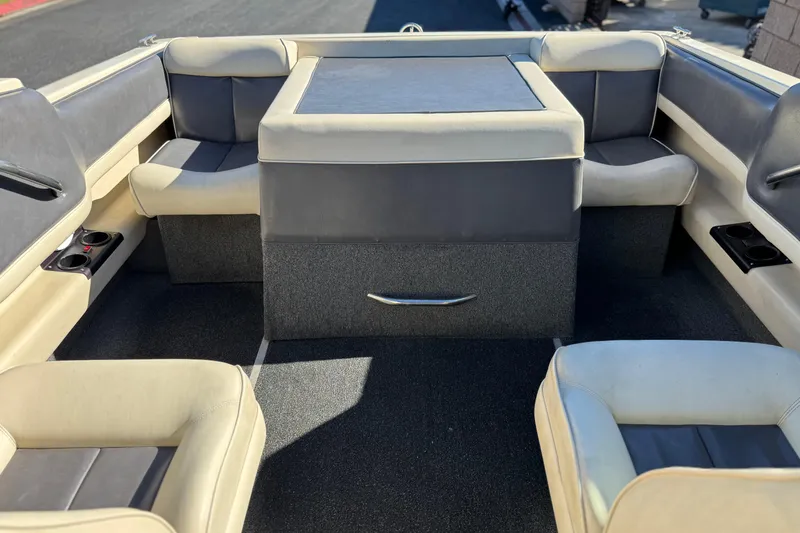 Slide: The Image of Interior of a 1988 Cobalt 222 boat with beige and gray seating. - 14