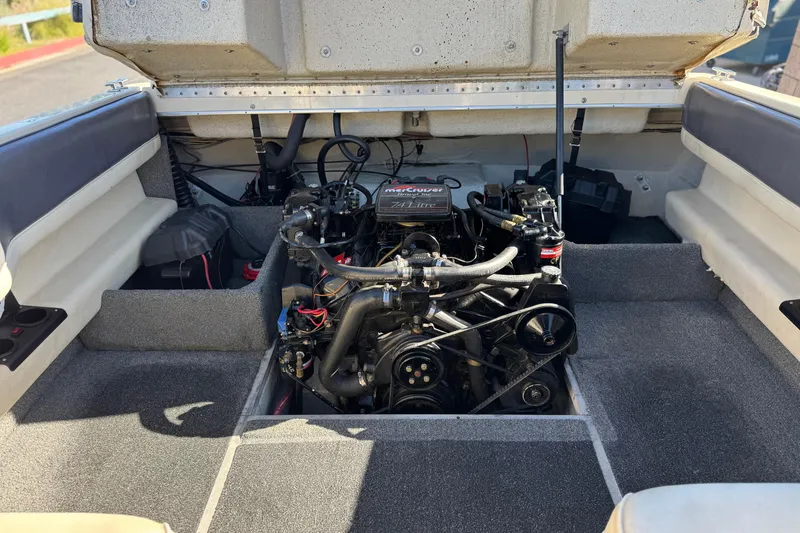 Slide: The Image of 1988 Cobalt 222 boat engine compartment with MerCruiser engine, open hatch view. - 15