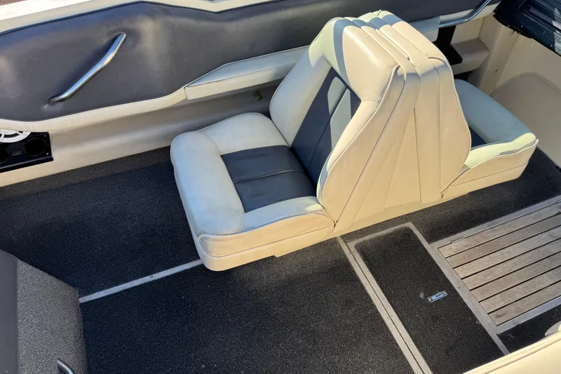 Slide: The Image of Interior of a 1988 Cobalt 222 boat with beige and gray seating. - 17