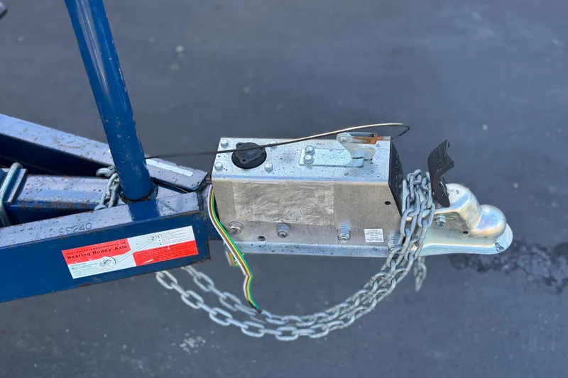 Slide: The Image of Trailer hitch with safety chains and wiring on a 1988 Cobalt 222. - 26