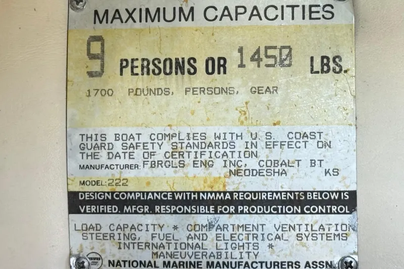 Slide: The Image of 1988 Cobalt 222 capacity plate: 9 persons or 1450 lbs, U.S. Coast Guard compliant. - 27