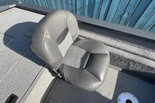Slide: The Image of 2019 Tracker Pro Team 175 TF boat seat, gray upholstery, on deck. - 16