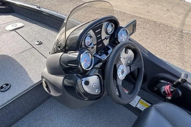 Slide: The Image of 2019 Tracker Pro Team 175 TF boat dashboard with steering wheel and gauges. - 18