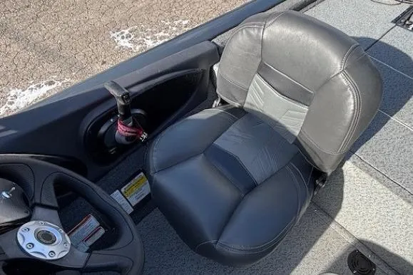 Slide: The Image of 2019 Tracker Pro Team 175 TF boat seat and steering wheel interior. - 20