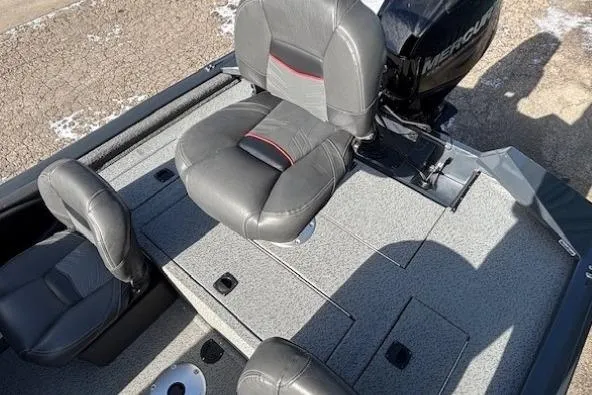 Slide: The Image of 2019 Tracker Pro Team 175 TF boat interior with gray seating and Mercury engine. - 21