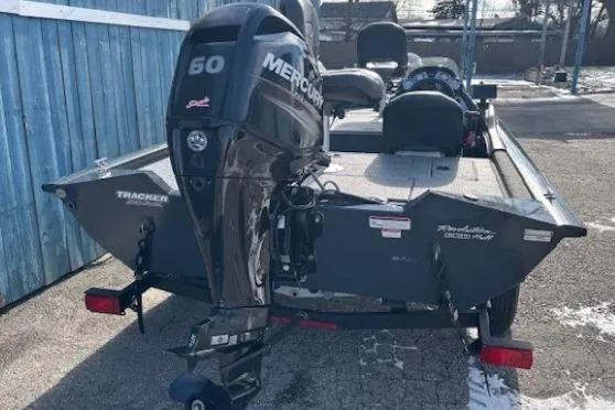 Slide: The Image of 2019 Tracker Pro Team 175 TF boat with Mercury 60 engine, parked outdoors. - 4