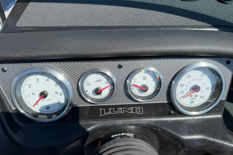 Slide: The Image of Dashboard of 2026 Lund 1875 Pro-V boat with gauges and controls. - 13