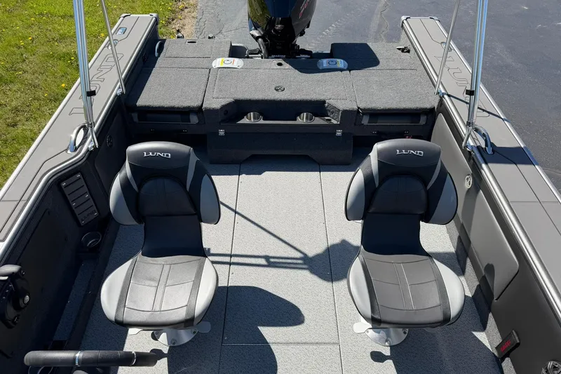 Slide: The Image of 2026 Lund 1875 Pro-V boat interior with two seats and spacious deck. - 19