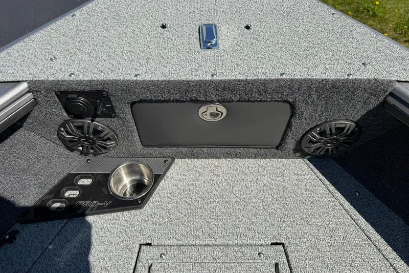 Slide: The Image of 2026 Lund 1875 Pro-V boat interior with speakers and cup holder. - 20