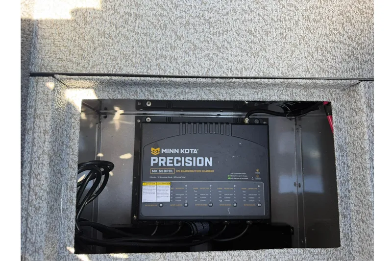 Slide: The Image of Minn Kota Precision battery charger in 2026 Lund 1875 Pro-V boat compartment. - 33