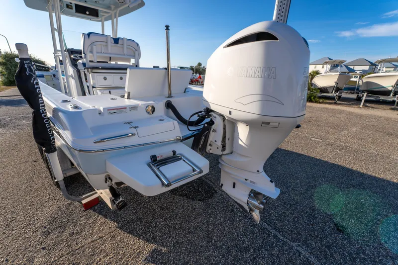Slide: The Image of 2017 Crevalle 26 Open boat with Yamaha outboard engine, parked on a sunny day. - 13