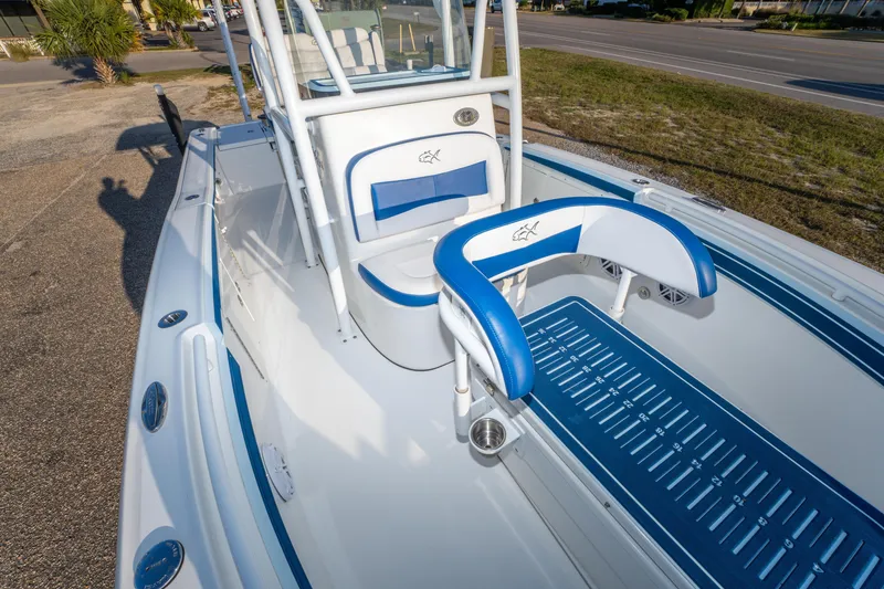 Slide: The Image of 2017 Crevalle 26 Open boat interior with blue and white seating and deck. - 18