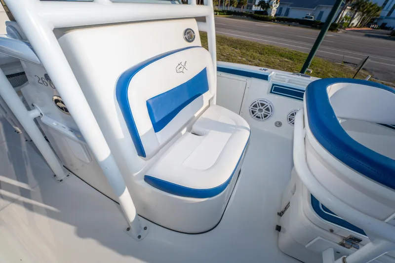 Slide: The Image of 2017 Crevalle 26 Open boat interior with blue and white seating. - 19