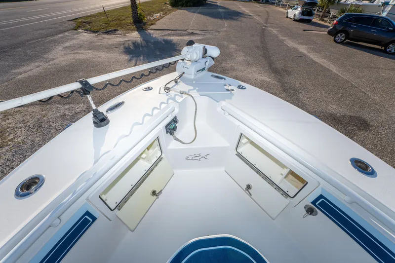 Slide: The Image of 2017 Crevalle 26 Open boat bow with storage compartments and trolling motor. - 20