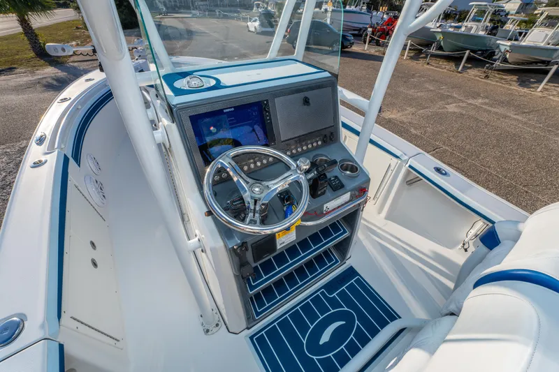 Slide: The Image of 2017 Crevalle 26 Open boat cockpit with steering wheel and navigation system. - 25