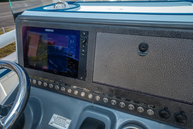 Slide: The Image of Dashboard of 2017 Crevalle 26 Open boat with Simrad display and controls. - 26