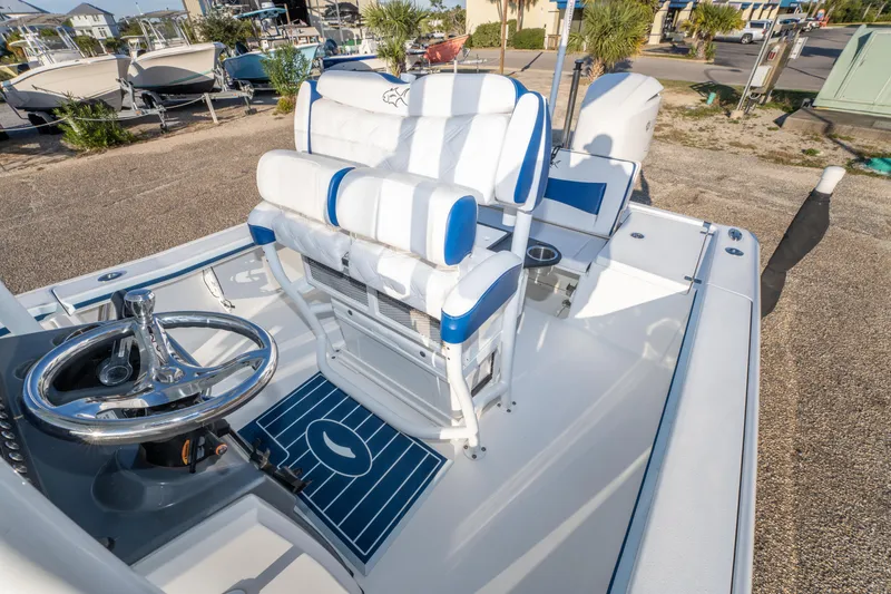 Slide: The Image of 2017 Crevalle 26 Open boat interior with steering wheel and seating. - 28