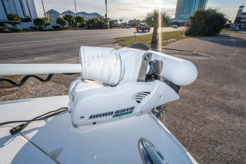 Slide: The Image of Minn Kota trolling motor on 2017 Crevalle 26 Open boat, parked near a road. - 37