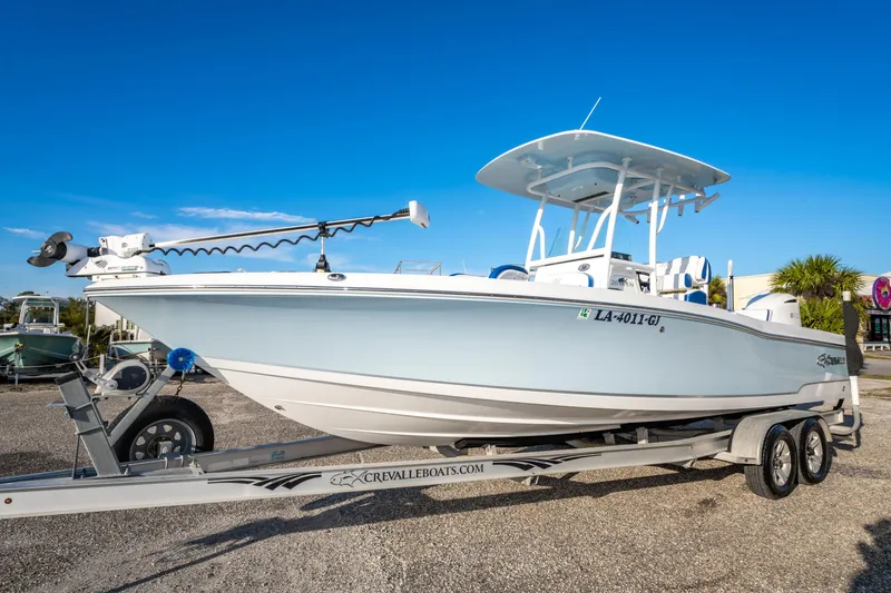 Slide: The Image of 2017 Crevalle 26 Open boat on trailer under clear blue sky. - 5