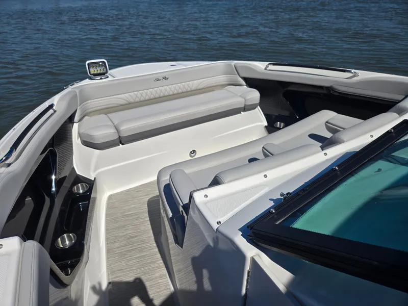 Slide: The Image of The image shows the cockpit of a 2027 Sea Ray SLX 360 Outboard with sleek seating. - 23