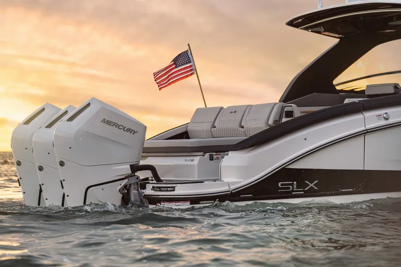 Slide: The Image of The 2027 Sea Ray SLX 360 Outboard on the water, with an American flag in the background. - 2