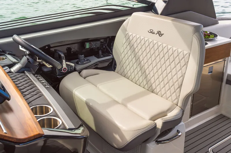 Slide: The Image of The helm of the 2027 Sea Ray SLX 360 Outboard features a luxurious, quilted-patterned seat. - 5