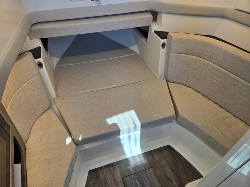 Slide: The Image of Interior view of a Sea Ray SLX 360 Outboard with cushioned seating and wooden flooring. - 18