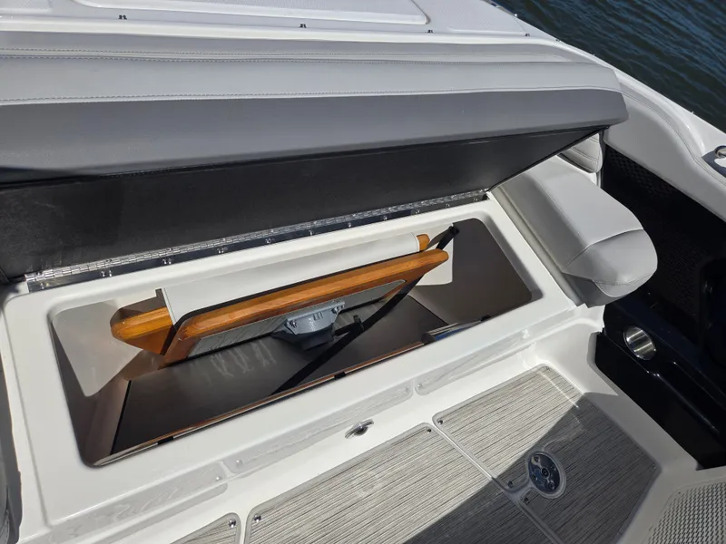 Slide: The Image of An open storage compartment on a 2027 Sea Ray SLX 360 Outboard boat. - 24
