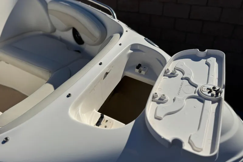 Slide: The Image of 2005 Chaparral 210 SSi boat interior with open storage compartment. - 15
