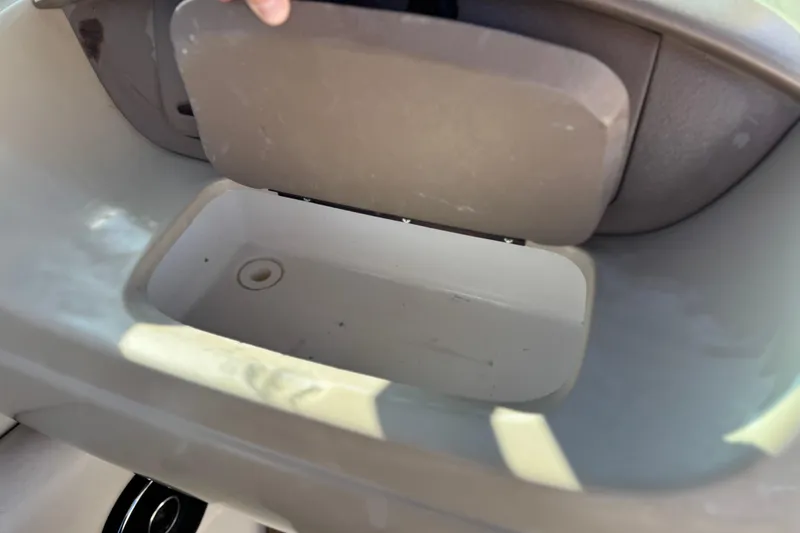 Slide: The Image of Storage compartment in a 2005 Chaparral 210 SSi boat, open and empty. - 27