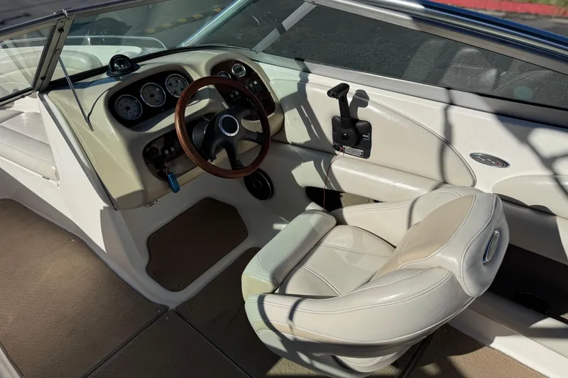 Slide: The Image of 2005 Chaparral 210 SSi boat interior with steering wheel and dashboard controls. - 31
