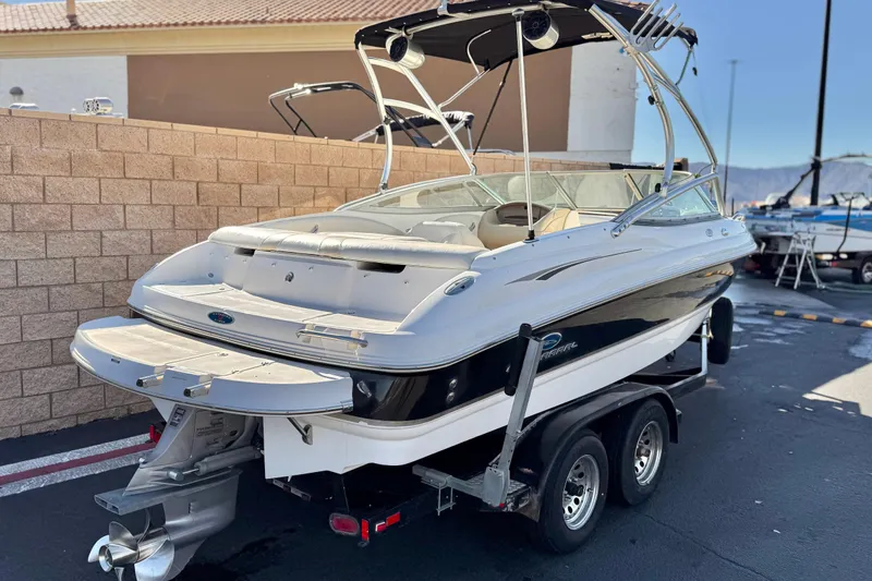 Slide: The Image of 2005 Chaparral 210 SSi boat on trailer, parked outdoors, rear view. - 5