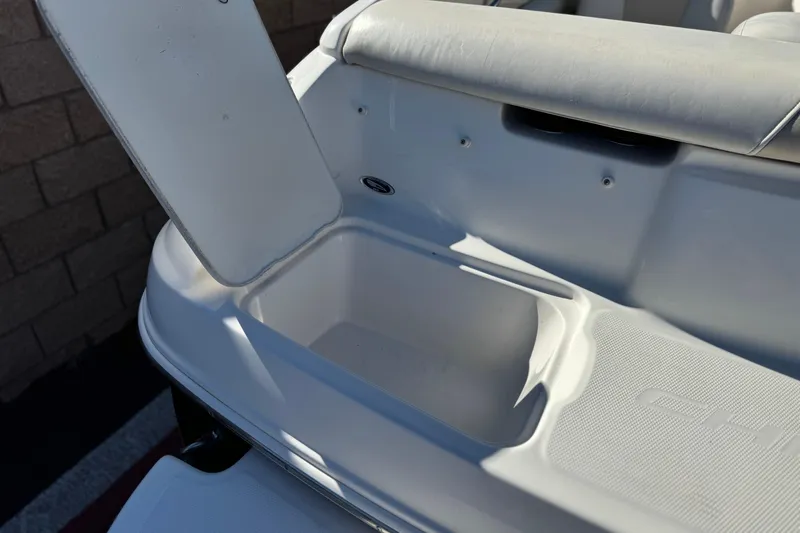 Slide: The Image of Open storage compartment on a 2005 Chaparral 210 SSi boat, showcasing interior space. - 7