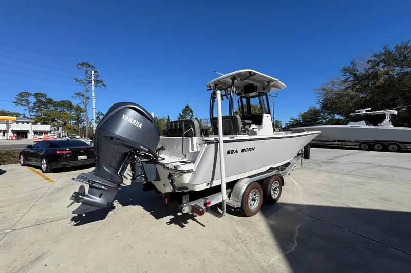 Slide: The Image of 2026 Sea Born LX24 Center Console boat with Yamaha engine on trailer. - 12