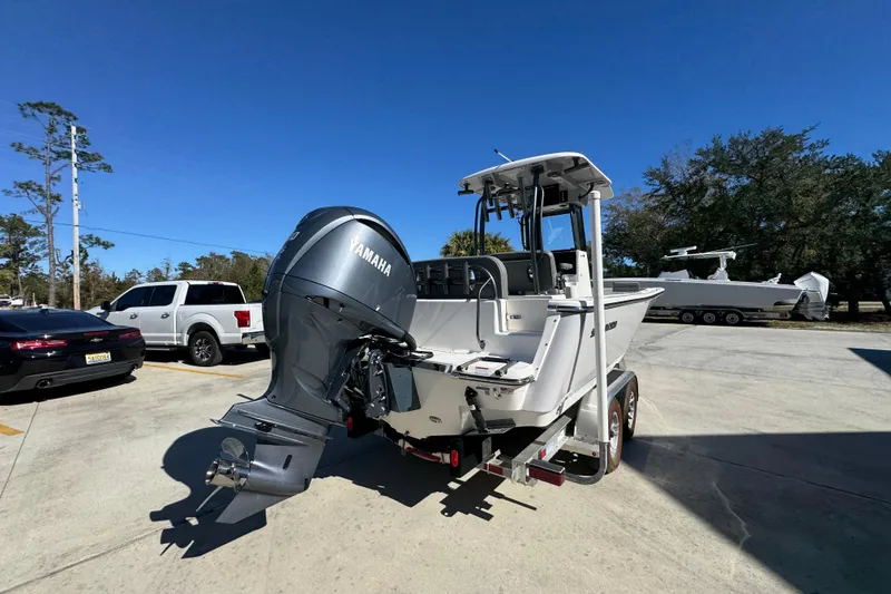 Slide: The Image of 2026 Sea Born LX24 Center Console boat with Yamaha engine on trailer. - 13