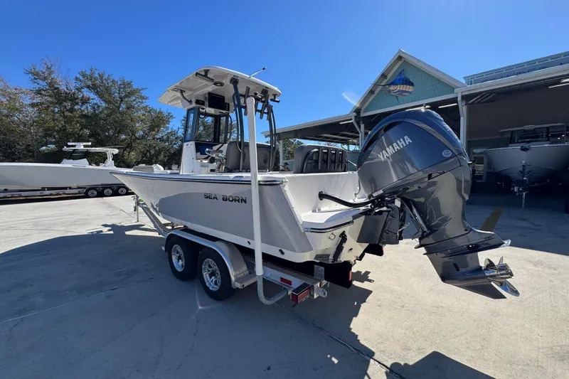 Slide: The Image of 2026 Sea Born LX24 Center Console boat with Yamaha engine on trailer. - 16