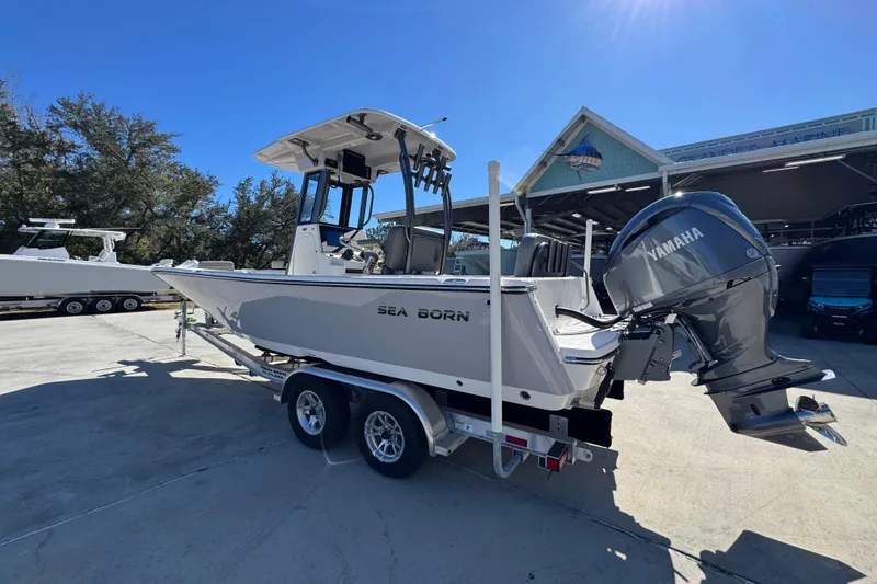 Slide: The Image of 2026 Sea Born LX24 Center Console boat with Yamaha engine on trailer. - 17