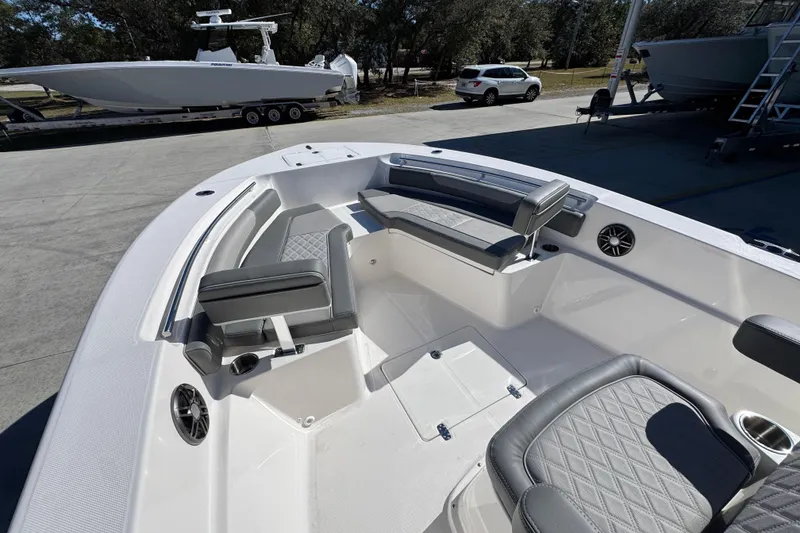 Slide: The Image of 2026 Sea Born LX24 Center Console boat interior with gray seating and modern design. - 20