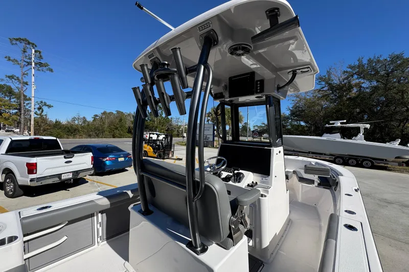 Slide: The Image of 2026 Sea Born LX24 Center Console boat with modern helm and rod holders. - 33