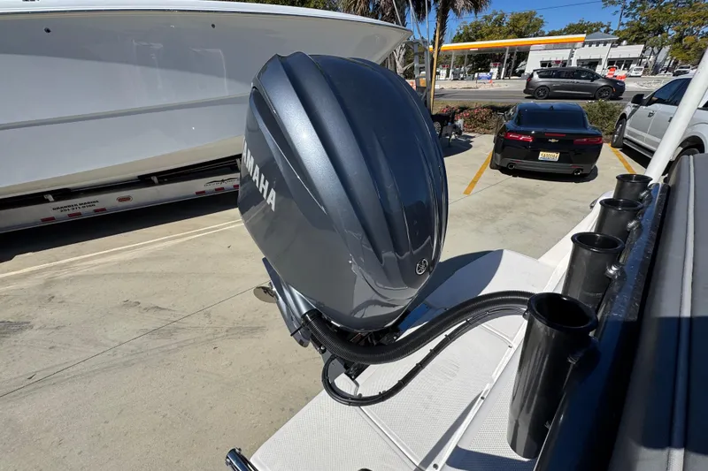 Slide: The Image of 2026 Sea Born LX24 Center Console with Yamaha outboard motor in parking lot. - 38