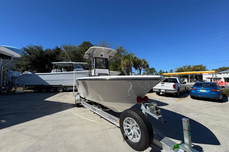 Slide: The Image of 2026 Sea Born LX24 Center Console boat on trailer in parking lot. - 6