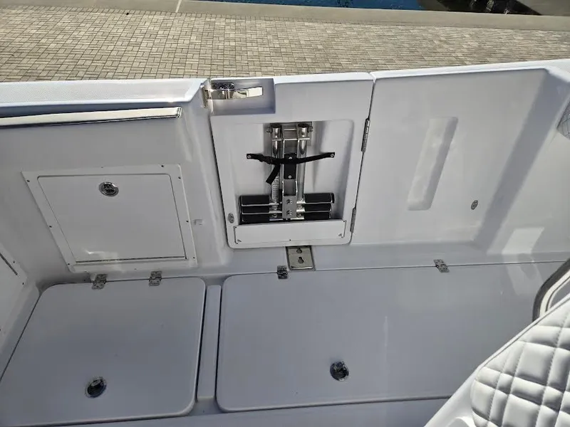 Slide: The Image of 2024 Century 3200 boat interior with storage compartments. - 12