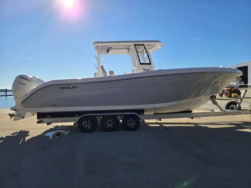 Slide: The Image of 2024 Century 3200 boat on trailer under sunny sky. - 3