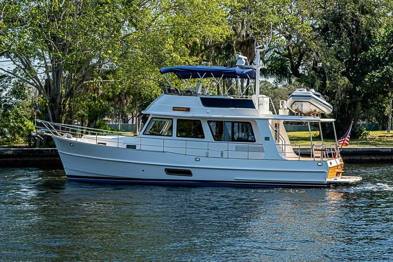 The Image of 2013 Grand Banks 43 Europa yacht cruising on a serene waterway. - 0