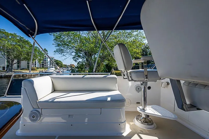 Slide: The Image of Luxurious seating area on 2013 Grand Banks 43 Europa yacht, featuring comfortable white cushions. - 24