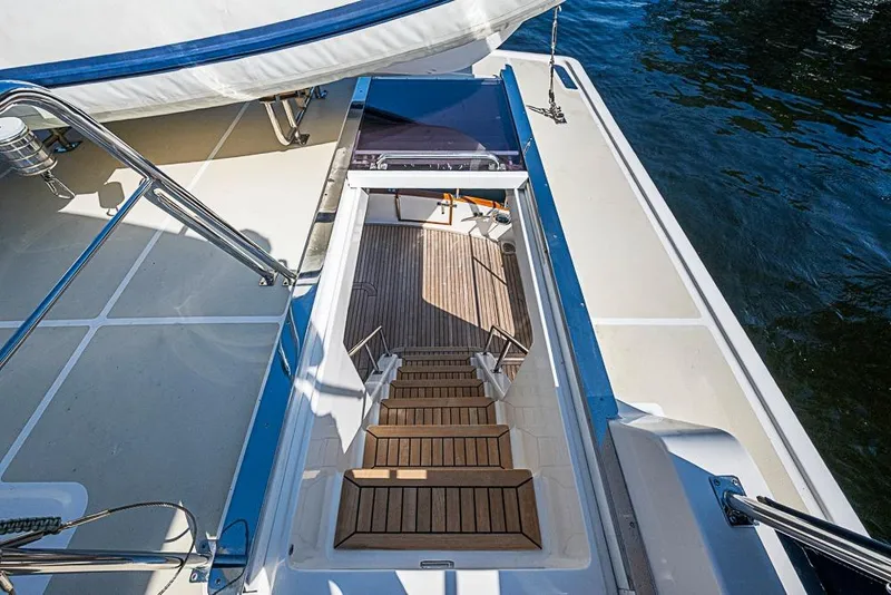 Slide: The Image of Staircase on 2013 Grand Banks 43 Europa yacht leading to lower deck by the water. - 27