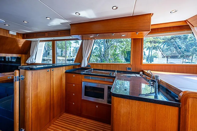 Slide: The Image of Luxurious 2013 Grand Banks 43 Europa yacht interior with modern kitchen and wood finishes. - 35