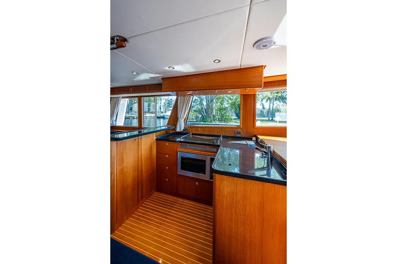 Slide: The Image of Luxurious kitchen interior of 2013 Grand Banks 43 Europa yacht with wood finish and modern appliances. - 36